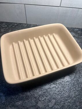 Pampered Chef ridged stone bakeware. Like new. Not sure if it’s ever been used